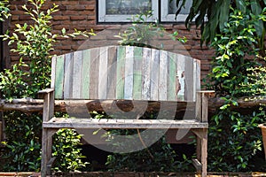 Lacquered wooden garden bench on the lawn