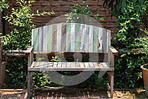 Lacquered wooden garden bench on the lawn