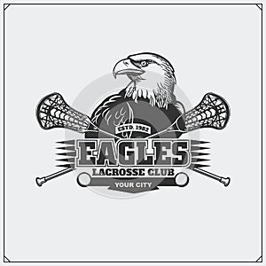 Lacrosse club emblem with eagle head.