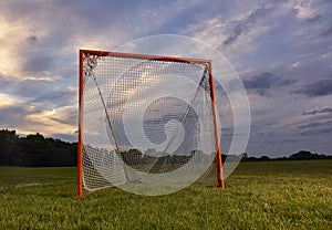 Lacrosse goal with sunset photo