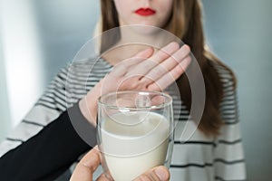 Lactose intolerance. Dairy Intolerant young girl refuses to drink milk
