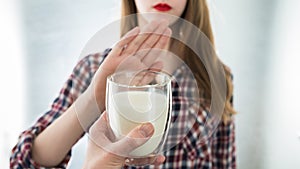 Lactose intolerance. Dairy Intolerant young girl refuses to drink milk