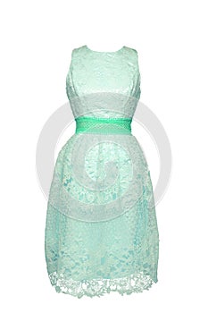 Lacy dress isolated. Closeup of a turquoise green stylish sleeveless evening dress with lace on mannequin isolated on a white