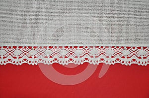 Lacy red and textile fabric ivory white background horizontal texture