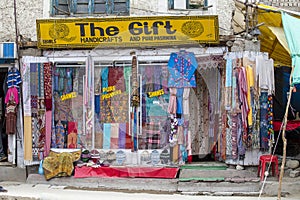Front view of Tibetan shop clothes and souvenirs outside the tourist town of Leh, India