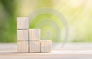 Ladder career path for business growth success process concept. Wooden blocks are stacked in steps that continue to rise