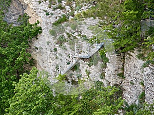 Ladder for descent on a cliff of limestone