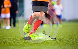 Ladder Drills Exercises for Football Soccer Team. Young Player Practice photo