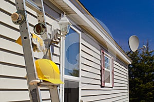 Ladder, Gloves, Hammer And Hard Hat