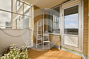 a ladder is leaning against a window on a balcony