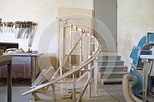 Fragment of curved handrails from lamellas of oak photo