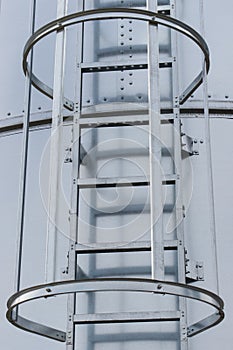 Ladder on silo for storage grain after harvest. Detail of agricultural equipments