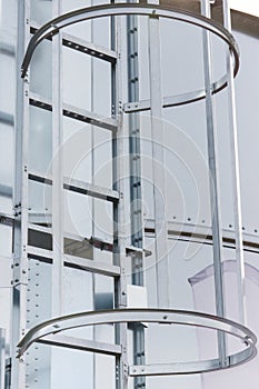 Ladder on silo for storage grain after harvest. Detail of agricultural equipments