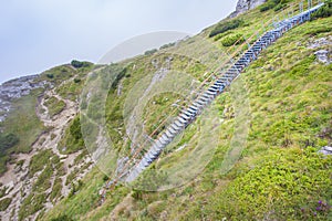 Ladder with stairs in the beautiful mountain landscape. Ceahlau