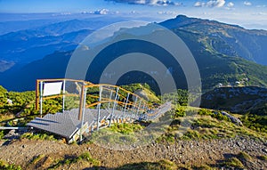 Ladder with stairs in the beautiful mountain landscape. Ceahlau, Toaca. photo
