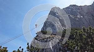 Ladder between two rock mountains on via ferrata Donnerkoge lin Austrian Alps