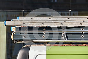 Ladders on top of a work van