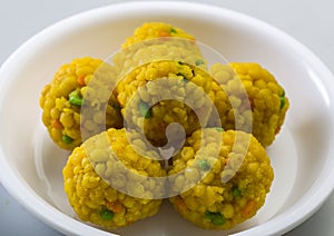 Laddu or laddoo are ball-shaped sweets popular in the Indian subcontinent.