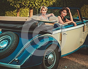 Ladies in a classic convertible