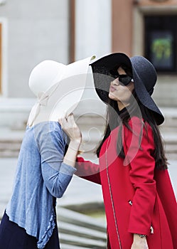 Ladies greeting with a kiss in italian style