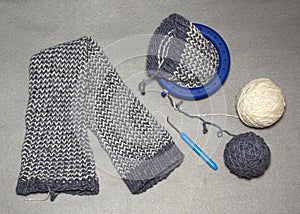 Ladies ` knitted gaiters from gray-white acrylic