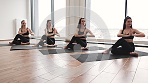 Ladies meditating in seated pose with hands in anjali mudra