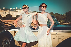 Ladies near classic convertible