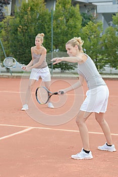 Ladies playing tennis doubles