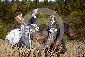 Ladies in 19th century dress riding horses