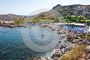 Ladiko bay with Ladiko beach with holiday makers Rhodes, Greece