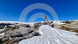 Ladinger Spitz - Man with backpack standing on massive rock formation at Steinerne Hochzeit, Saualpe, Lavanttal Alps, Austria photo