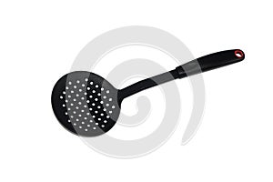 Ladle, spatula and skimmer from food plastic in black on a white background, isolate, kitchen utensils