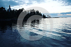 Ladoga lake. Late evening. Saint Nicholas`s church photo