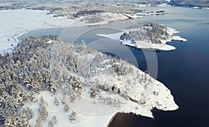 Ladoga Skerries, in winter in Karelia Russia Small  .stone islands in the snow on Lake Ladoga