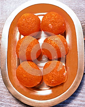 Ladoo dessert sweet-food Indian-food Indian-culture mithai snack Hinduism plate sugar-food tradition celebration circle temptation