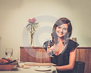 Lady alone in restaurant