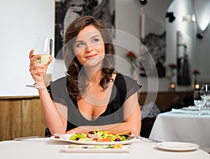 Lady alone in restaurant