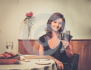 Lady alone in restaurant