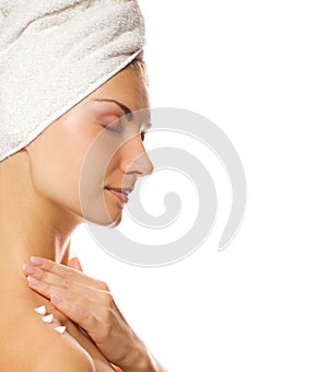 Lady applying moisturizer