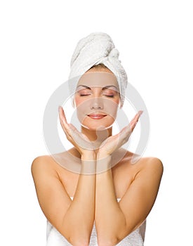 Lady applying moisturizer photo