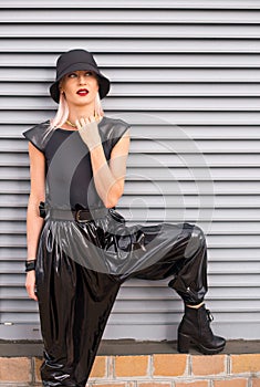 Lady in the black latex trousers and black sexy hat