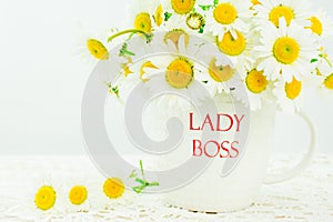 Lady boss mug with white  daisy flower on wooden background