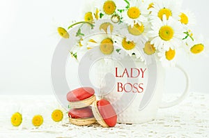 Lady boss mug with white  daisy flower on wooden background  and macaroon