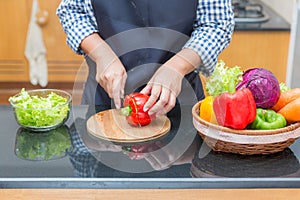 Lady chef preparing ingredient to make salad