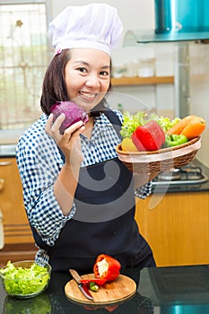 Lady chef preparing ingredient to make salad