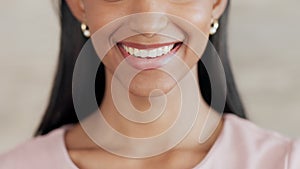 Lady with clean teeth smiling after her dentist appointment. Close up portrait of beautiful womans mouth with white