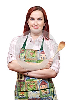 Lady cook wearing apron, holding a wooden spoon