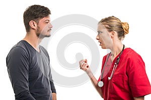 Lady doctor giving explanation to male patient