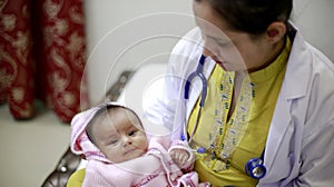 Lady doctor with her child patient.