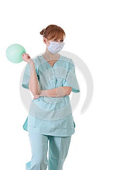 Lady doctor with respirator and air ball posing